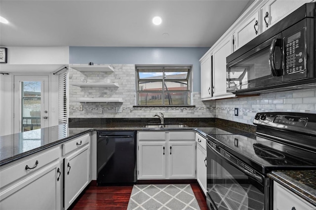 kitchen featuring open shelves, decorative backsplash, black appliances, and white cabinets