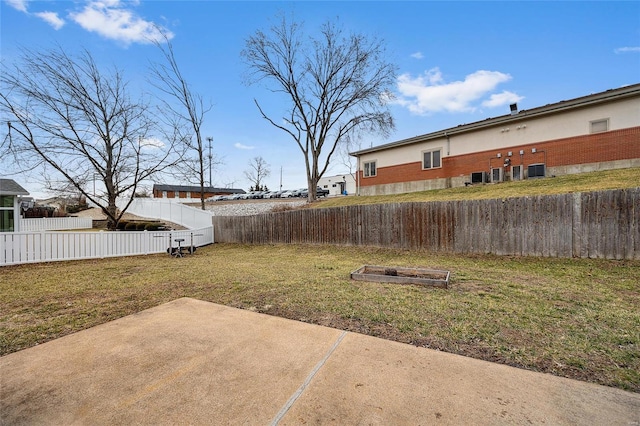 view of yard featuring a patio and a fenced backyard