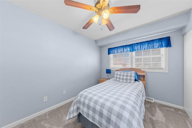 bedroom featuring carpet flooring, visible vents, baseboards, and ceiling fan