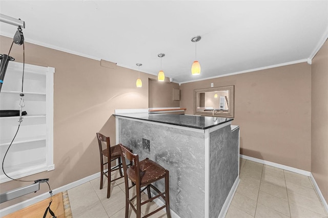 bar featuring baseboards, crown molding, and tile patterned flooring