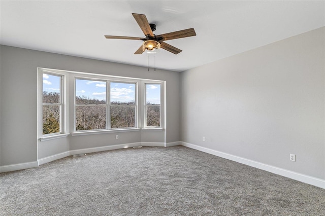 spare room with carpet flooring and baseboards