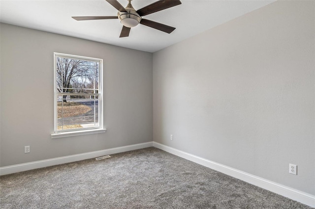 carpeted empty room featuring a ceiling fan, baseboards, and visible vents