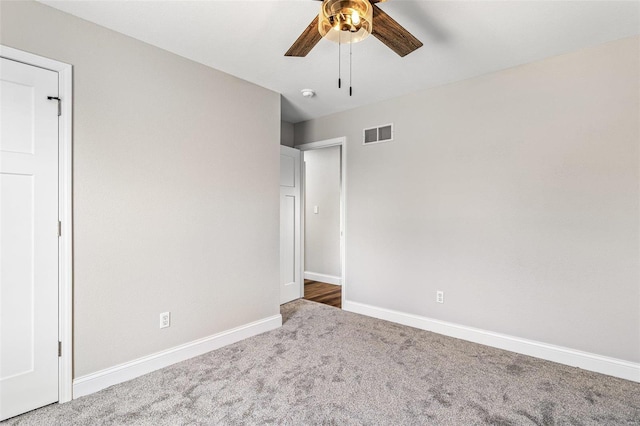 unfurnished bedroom with visible vents, ceiling fan, baseboards, and carpet floors