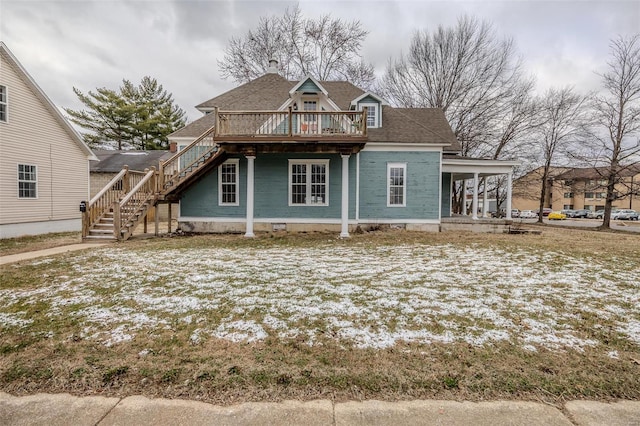 view of front of house with stairway and a wooden deck