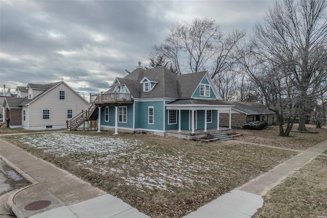 view of front of property featuring stairway and a chimney