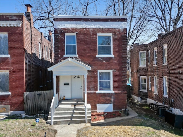 view of front of house with brick siding