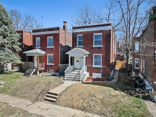 view of front of house featuring brick siding