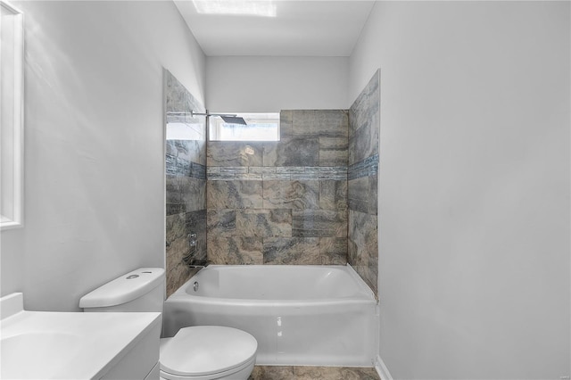 bathroom featuring toilet, vanity, and washtub / shower combination