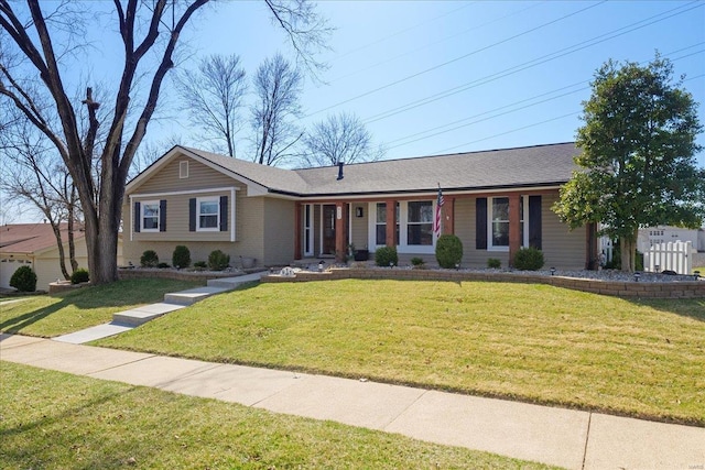 ranch-style house with brick siding and a front yard