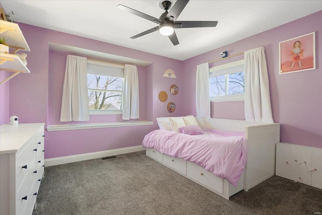 bedroom with visible vents, multiple windows, baseboards, and carpet flooring