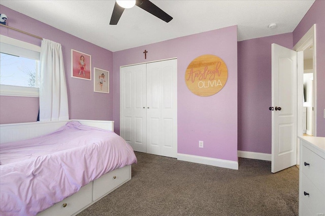 bedroom featuring a closet, baseboards, carpet, and ceiling fan