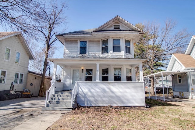 view of front of home featuring a porch and a carport