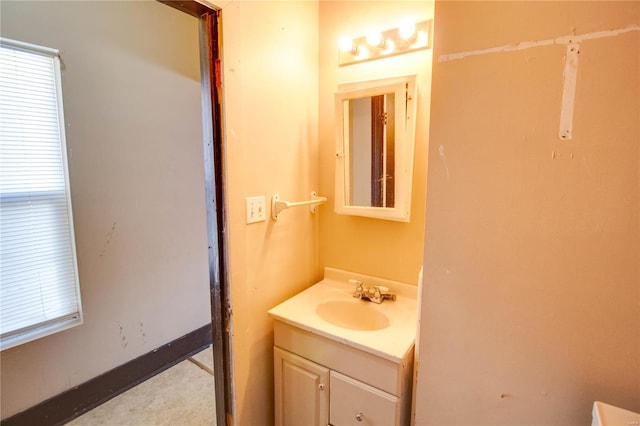 bathroom with vanity and baseboards