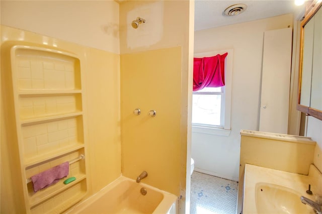 bathroom with visible vents, vanity, toilet, and  shower combination