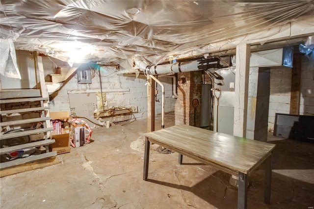 unfinished basement featuring water heater