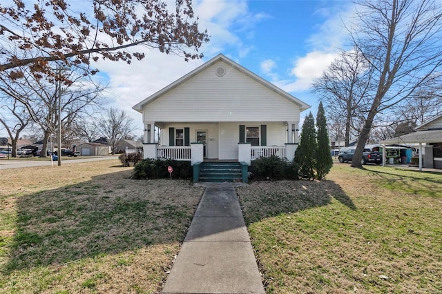 bungalow-style home with a porch and a front lawn