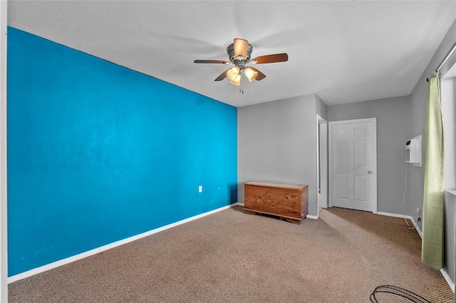 unfurnished bedroom featuring baseboards, carpet floors, and a ceiling fan