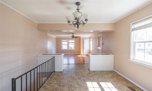 interior space featuring visible vents, baseboards, a notable chandelier, and ornamental molding