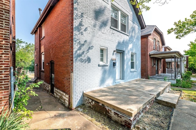 view of home's exterior featuring brick siding