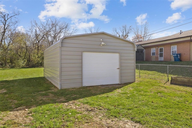 view of outdoor structure with an outbuilding and fence