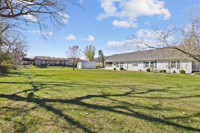 view of yard with an outdoor structure and a storage unit