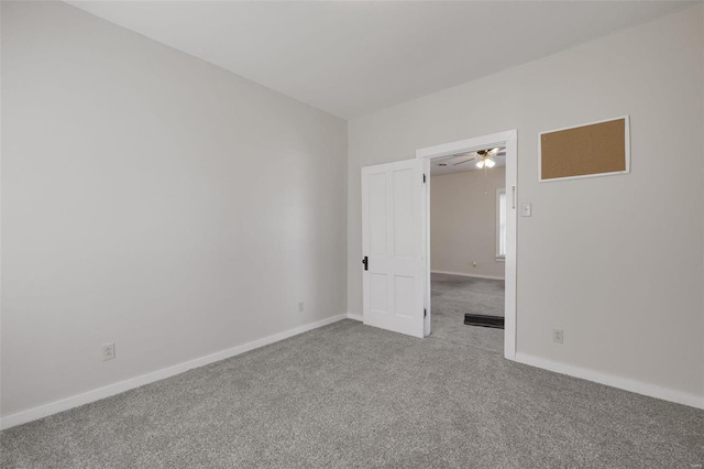 unfurnished bedroom with baseboards and carpet floors