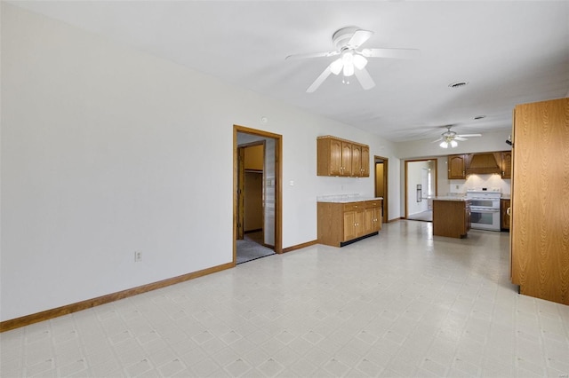 unfurnished living room with visible vents, light floors, baseboards, and ceiling fan