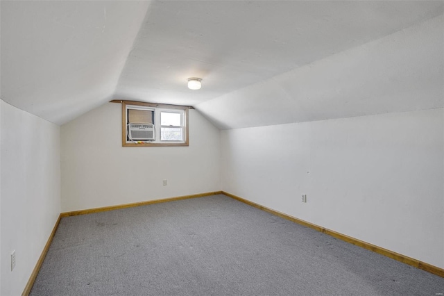 bonus room featuring vaulted ceiling, cooling unit, carpet, and baseboards