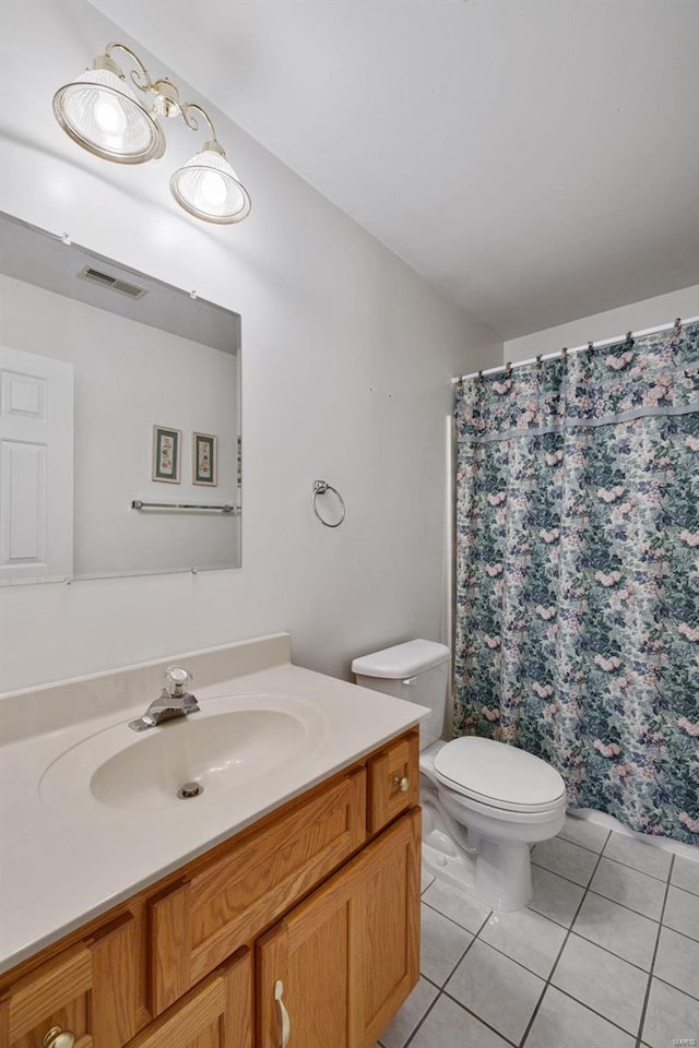 bathroom featuring tile patterned flooring, visible vents, toilet, a shower with shower curtain, and vanity