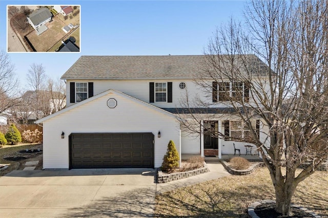 view of front of house with driveway and a garage