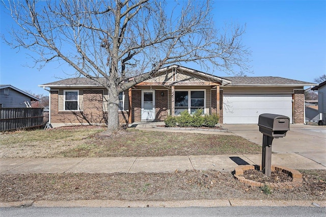 ranch-style house with fence, roof with shingles, concrete driveway, a garage, and brick siding