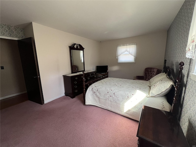 bedroom with baseboards and carpet flooring