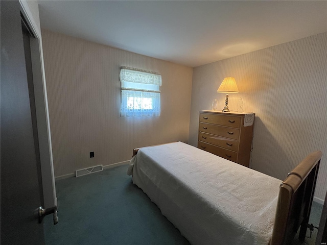 bedroom featuring visible vents, baseboards, and carpet