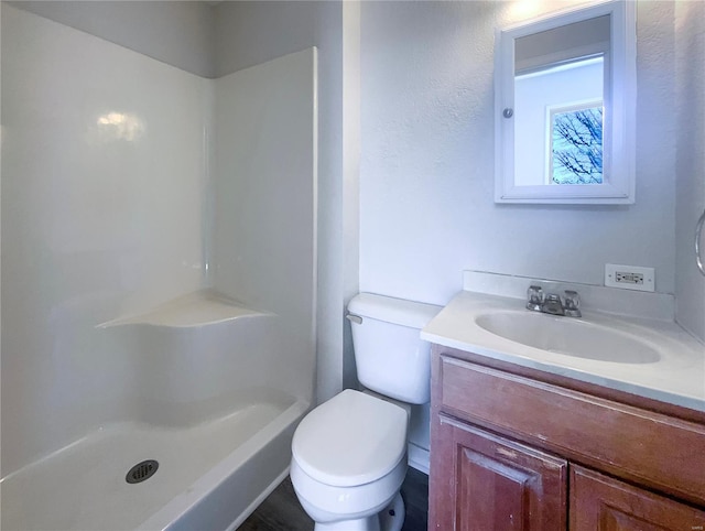 full bath with vanity, toilet, and walk in shower