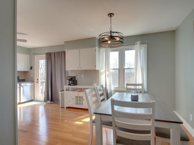 dining space featuring light wood-style floors