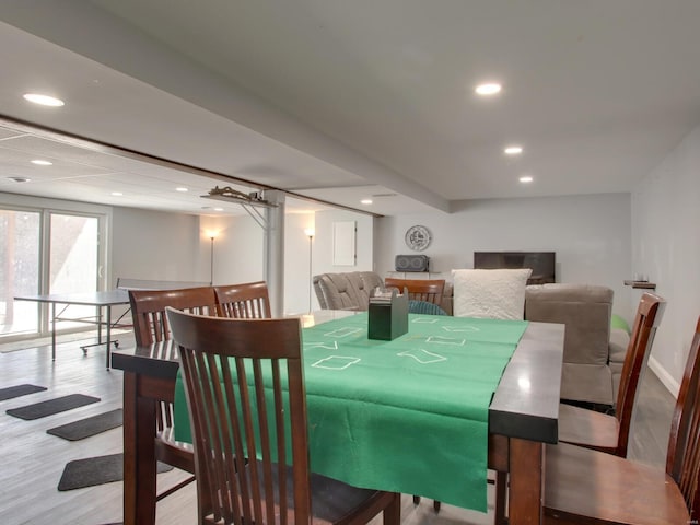 dining space with recessed lighting, baseboards, and wood finished floors