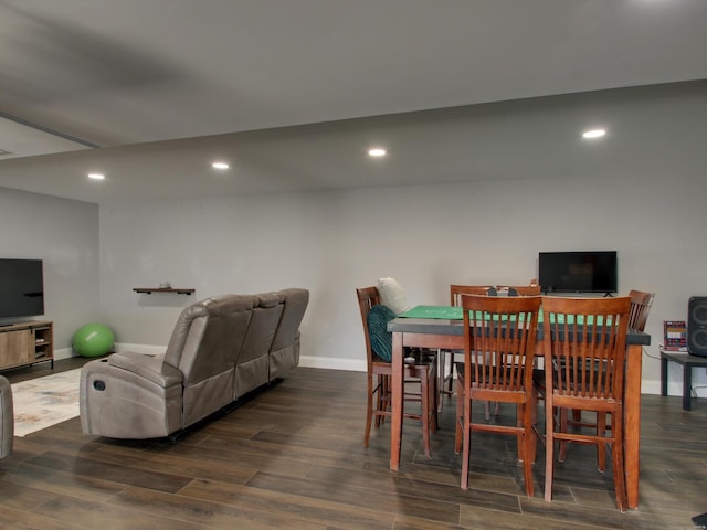 dining room featuring recessed lighting, baseboards, and wood finished floors