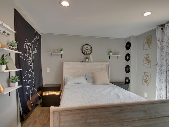 bedroom featuring recessed lighting and wood finished floors