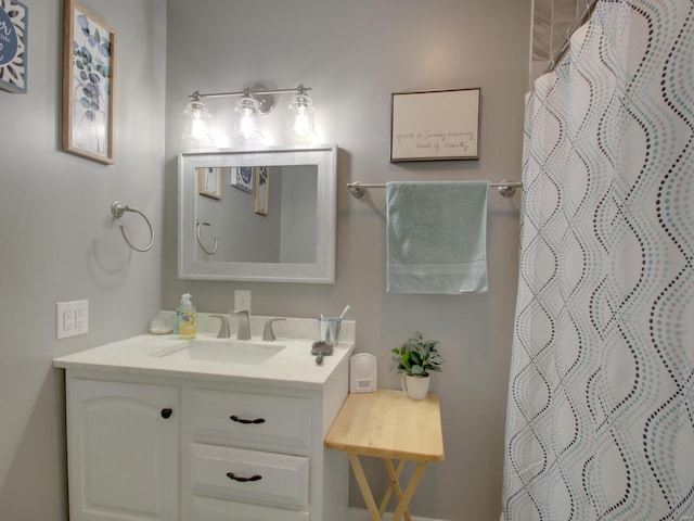 full bathroom featuring vanity and a shower with shower curtain