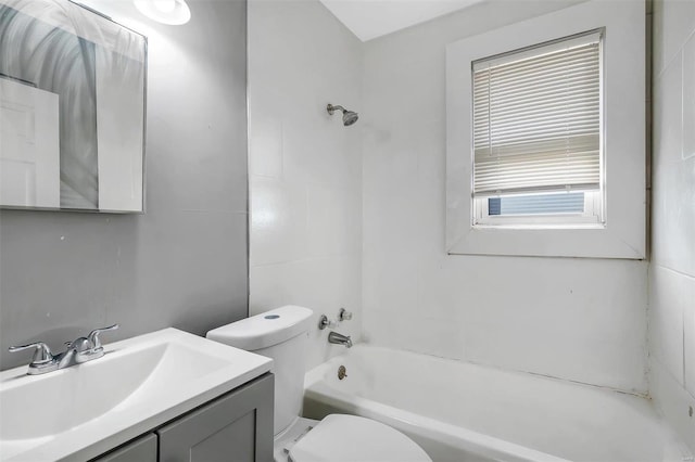 bathroom featuring toilet,  shower combination, and vanity