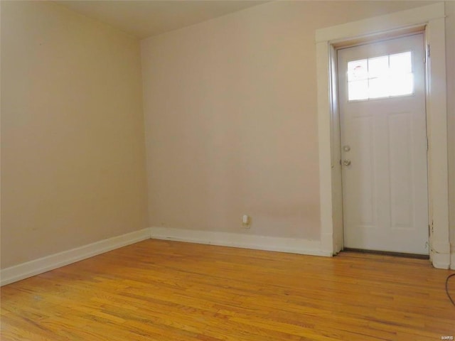 entrance foyer featuring baseboards and light wood-style flooring