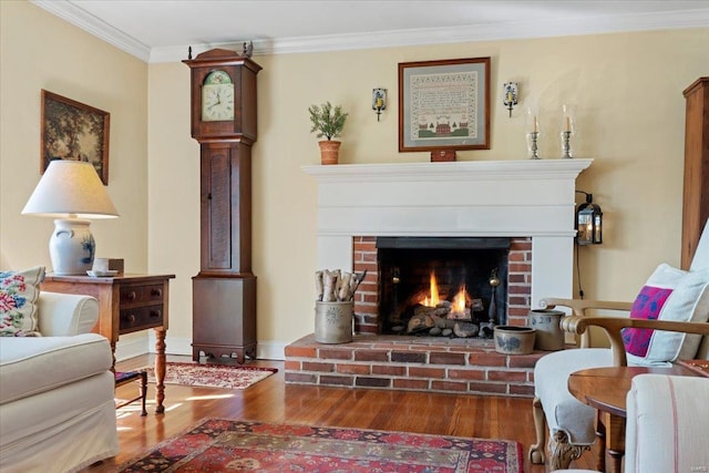 living area featuring a brick fireplace, wood finished floors, and ornamental molding