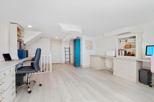 office featuring recessed lighting, light wood-style flooring, and built in study area