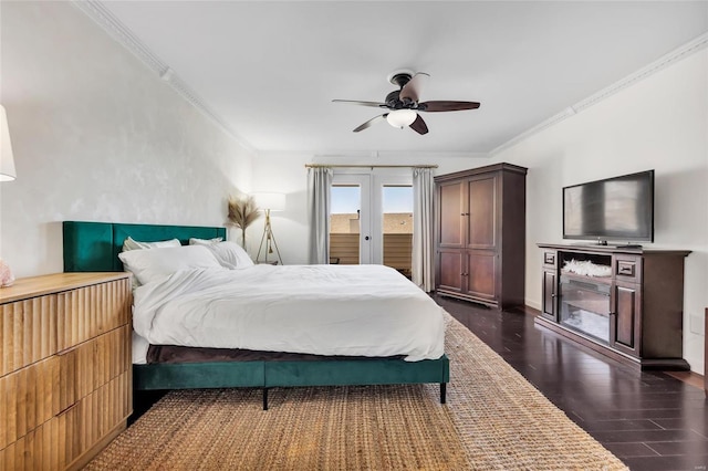 bedroom with ceiling fan, french doors, ornamental molding, and dark wood-style flooring