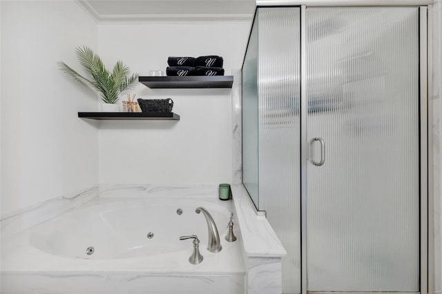 bathroom featuring a shower stall, a jetted tub, and crown molding