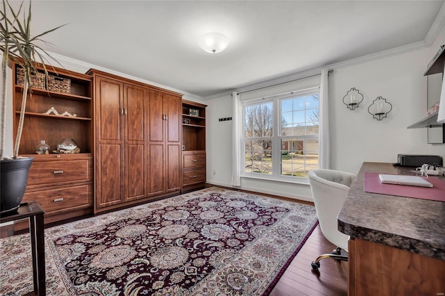 office area with crown molding, baseboards, and wood-type flooring