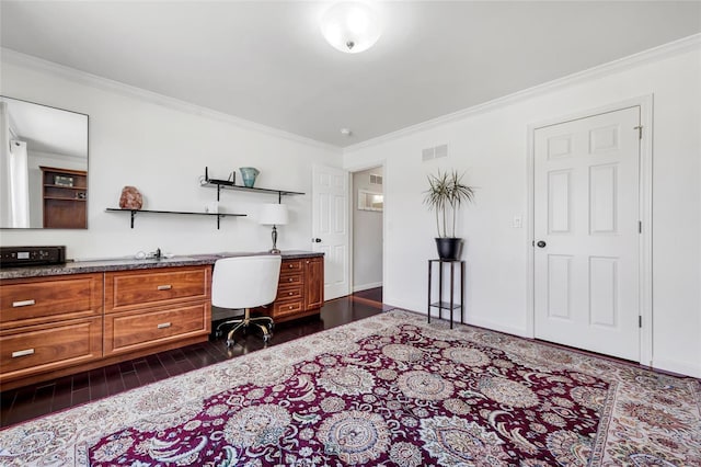 home office featuring visible vents, baseboards, dark wood-style floors, and ornamental molding