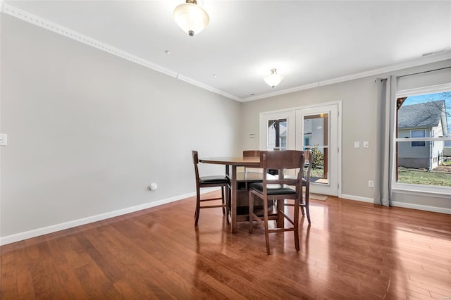 dining room featuring wood finished floors, baseboards, visible vents, french doors, and crown molding