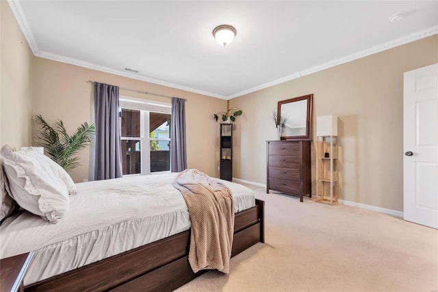 bedroom with visible vents, baseboards, light colored carpet, and ornamental molding