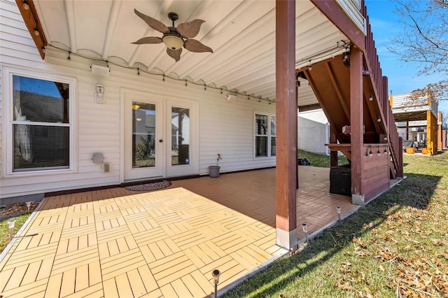 view of patio / terrace with a ceiling fan and french doors